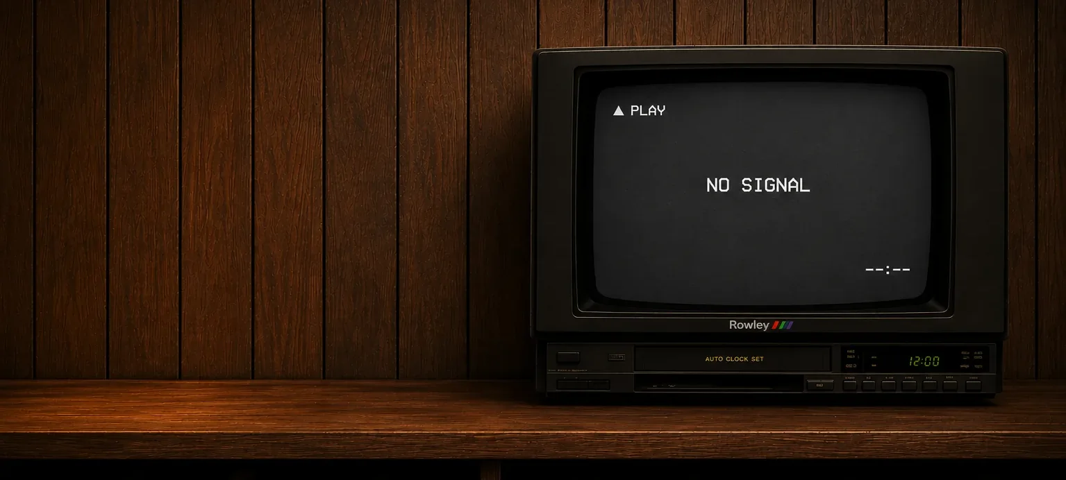 A wood-paneled shelf with a CRT television